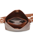 Brown leather bag with a strap on a white background