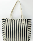 Black and white striped tote bag on a white background