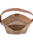 Woven basket with a brown handle on a white background