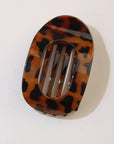 Tortoiseshell hair clip on a white background