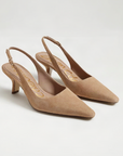 Pair of tan high-heeled slingback shoes on a light gray background