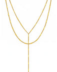 Two gold necklaces on a white background