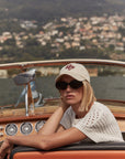 Woman on a boat with a scenic background