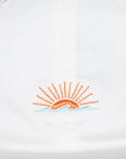 Embroidered sun design on a white background