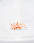 Embroidered logo on a white hat with orange sun design