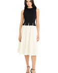 Woman wearing a black and white dress on a white background