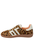 Leopard print sneaker with white stripes on a white background