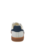 White sneaker with navy accents and brown sole on a white background