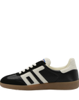 Black and white sneaker with a brown sole on a white background