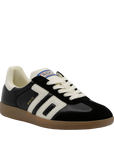 Black and white sneaker with visible branding on a white background