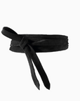 Black belt with a bow on a white background