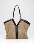 Beige mesh handbag with black trim on a white background