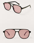 Two pairs of sunglasses with pink lenses on a white background