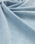 Close-up of light blue fabric with a soft texture