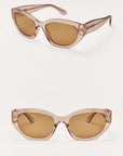 Pair of cat-eye sunglasses with brown lenses on a white background