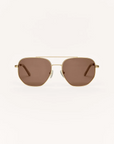 Gold-framed sunglasses with brown lenses on a white background