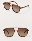 Pair of tortoiseshell sunglasses with brown gradient lenses on a white background