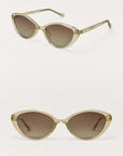 Cat-eye sunglasses with gold frame and brown gradient lenses on a white background