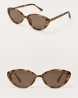 Pair of tortoiseshell cat-eye sunglasses on a white background