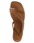 Brown sandal with a strap on a white background