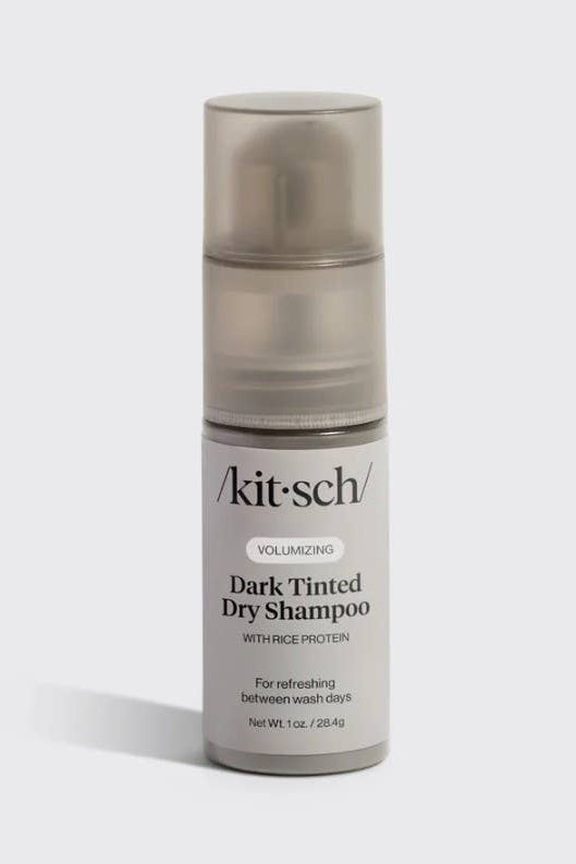 Kit-Sch dark tinted dry shampoo bottle on a light gray background