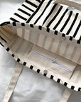 Striped bag with a zipper pocket on a white background