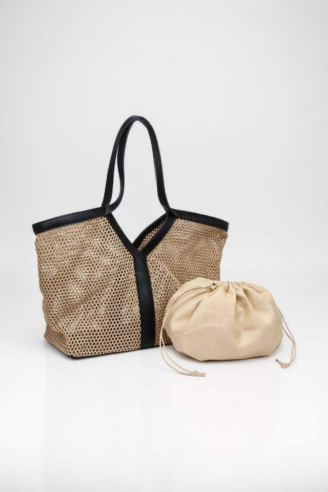 Woven bag with black trim and a beige drawstring pouch on a white background