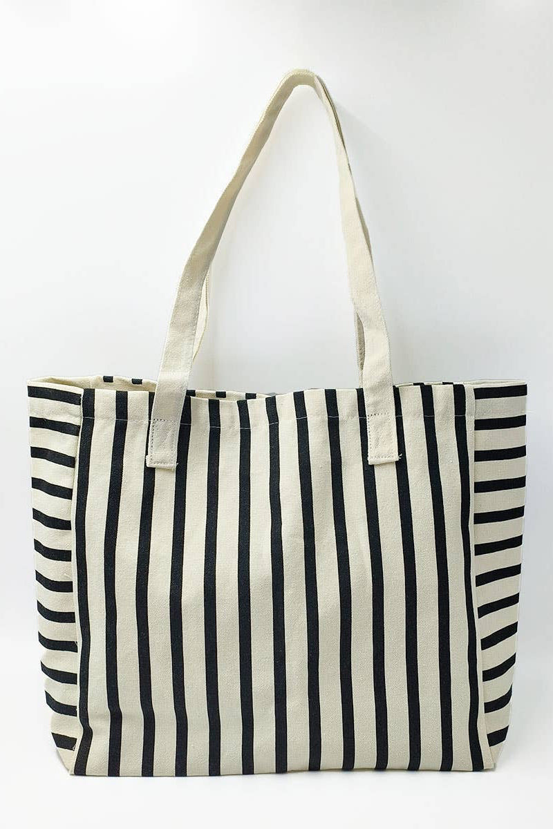 Black and white striped tote bag on a white background
