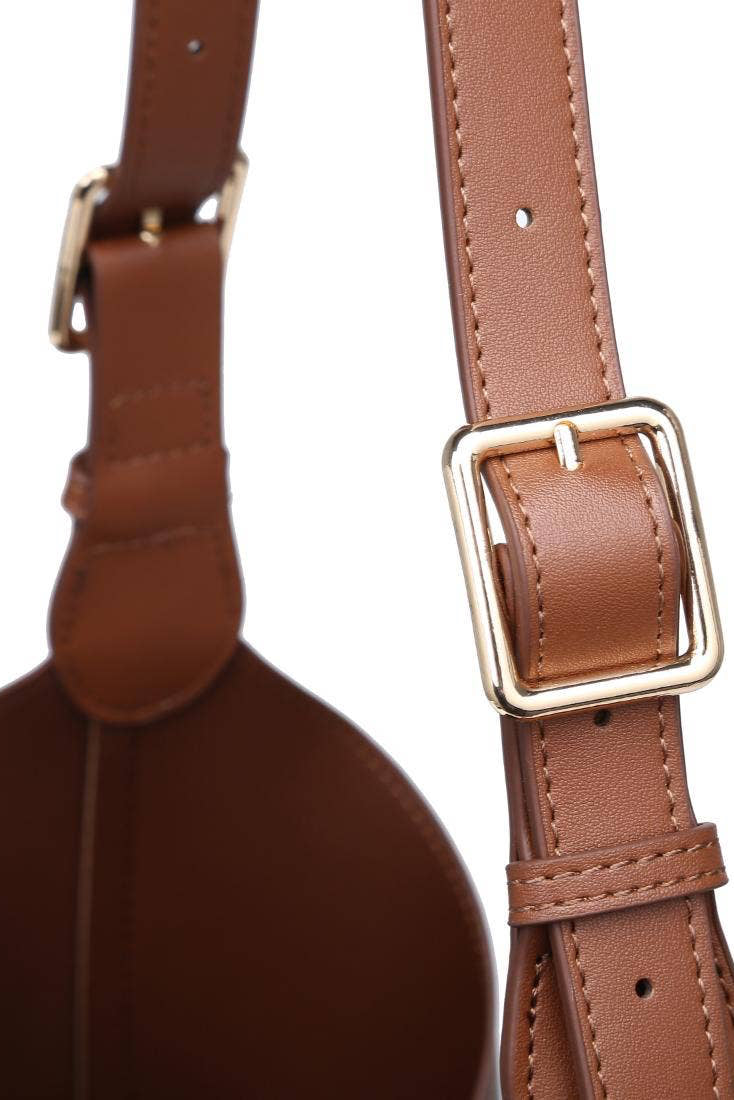Brown leather strap with gold buckle on a white background