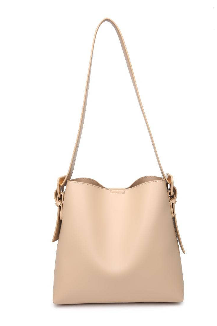 Beige handbag with a shoulder strap on a white background