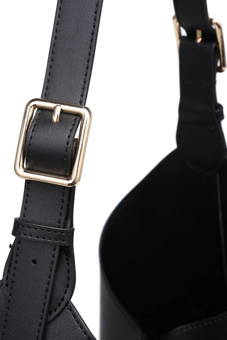 Black leather bag with gold buckle on a white background