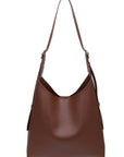 Brown leather handbag on a white background