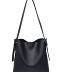 Black handbag with a shoulder strap on a white background
