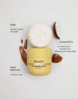 A jar of Akit-sch Deep Conditioning Coconut Oil Treatment Mask is shown open with white cream visible, surrounded by coconut pieces on a light gray background with callout text describing benefits.