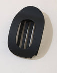 Black rubber grommet on a white background