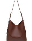 Brown leather handbag with a shoulder strap on a white background