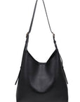 Black handbag on a white background