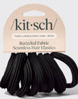A pack of black seamless hair elastics by kit·sch, packaged on a beige cardboard header card that reads 'Thick, Long & Curly Hair | 8PCS' and 'Recycled Fabric Seamless Hair Elastics.'.