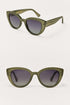 Green cat-eye sunglasses on a white background