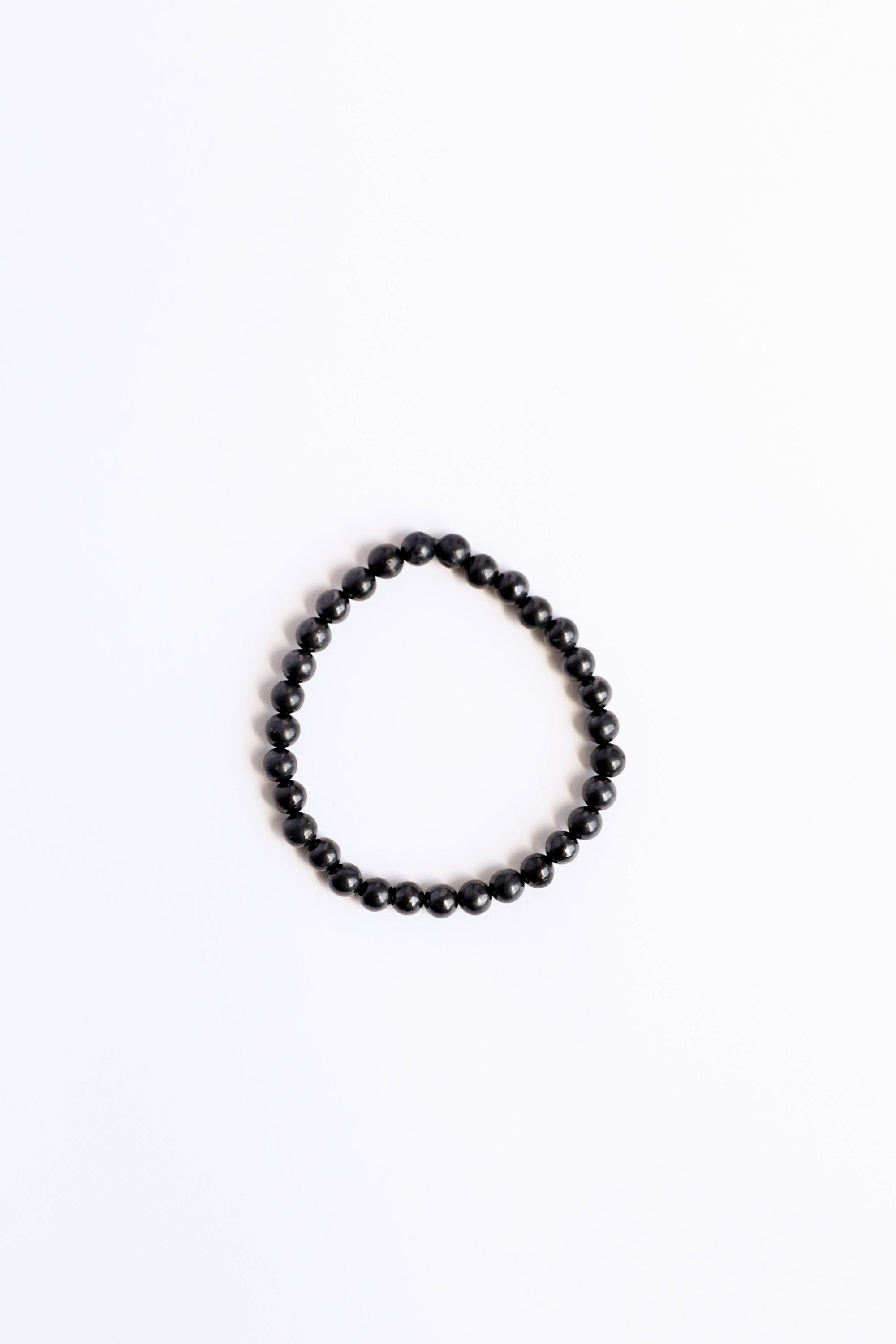 Black beaded bracelet on a white background