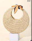 Woven straw collar with orange ribbon on a white background