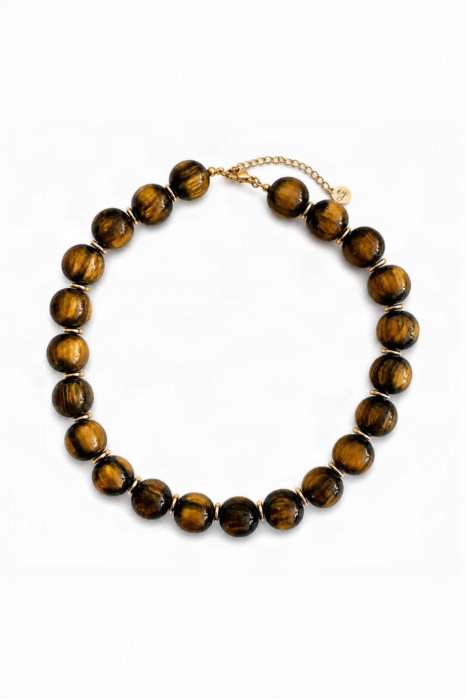 A beaded necklace made of polished tiger's eye beads with gold spacer rings and a gold chain clasp, displayed on a clean white background.