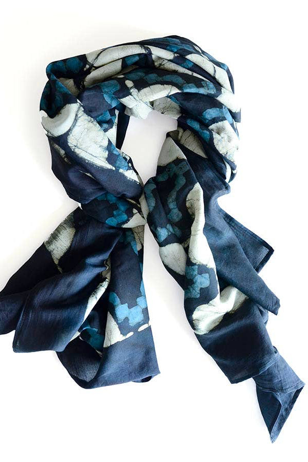 Blue and white patterned scarf on a white background