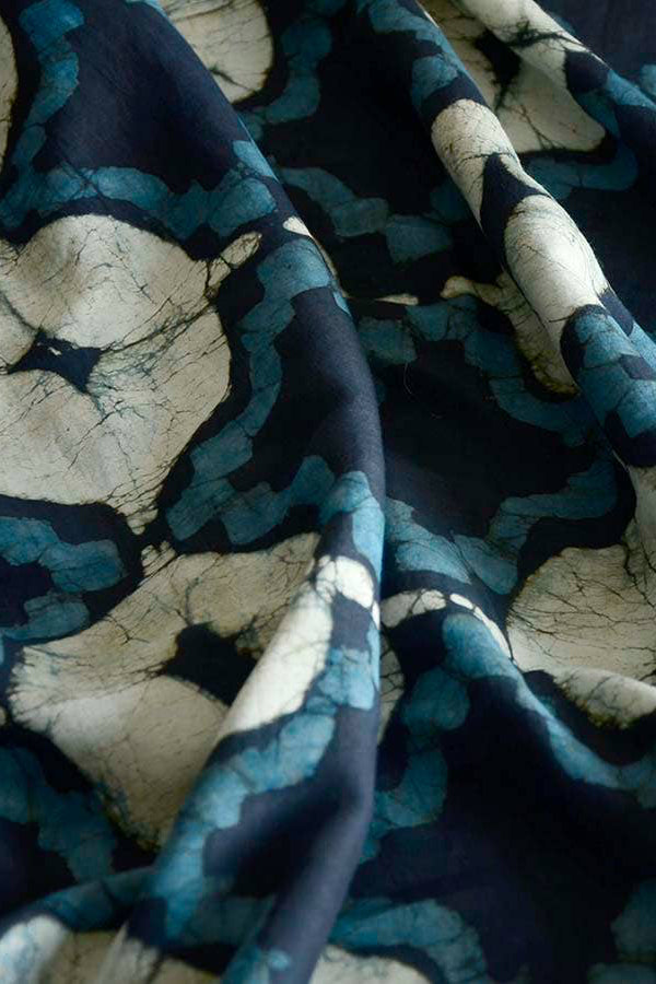 Close-up of fabric with blue and beige abstract pattern