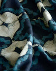 Close-up of fabric with blue and beige abstract pattern