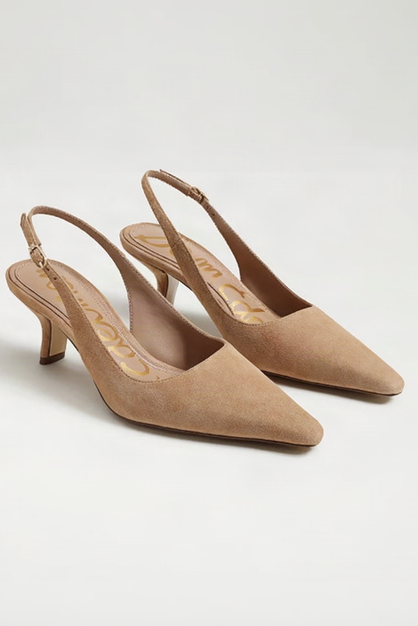 Pair of tan high-heeled slingback shoes on a light gray background