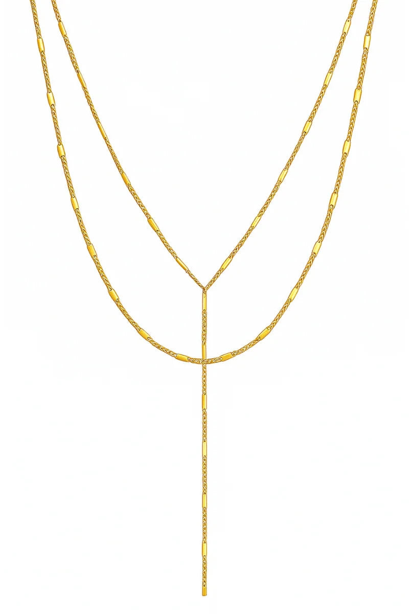 Two gold necklaces on a white background