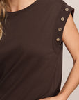 Brown sleeveless top with button details on a neutral background