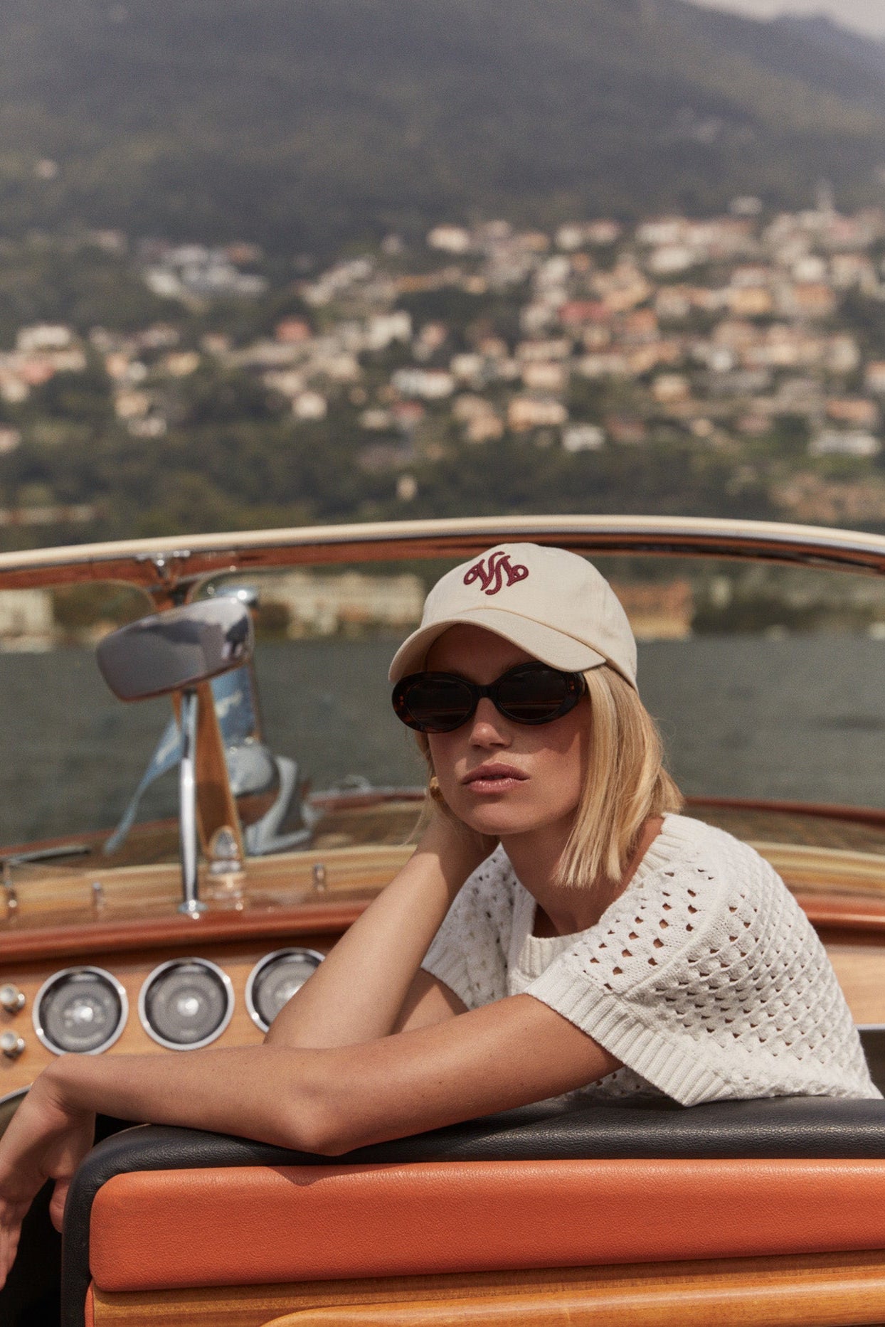 Woman on a boat with a scenic background