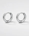 Pair of silver hoop earrings on a white background